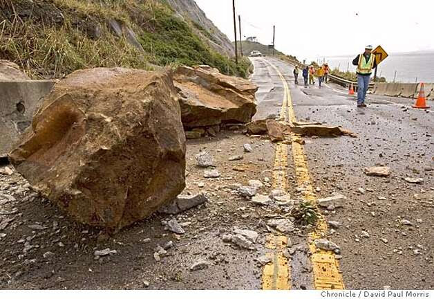 Cal Trans workers look over a recent rock slide along Highway 1 at the Devils Slide area on April 3, 2006 in Pacifica. Photo: David Paul Morris / SF