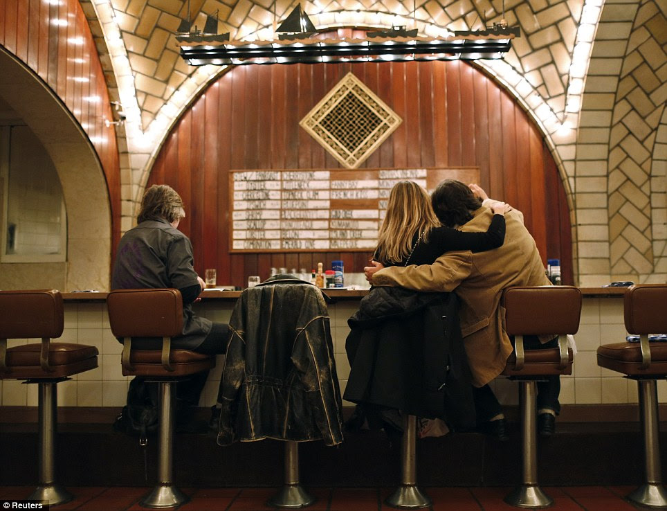 Customers sit at the counter of the Oyster bar in the lower level of Grand Central Terminal in New York, January 29, 2013