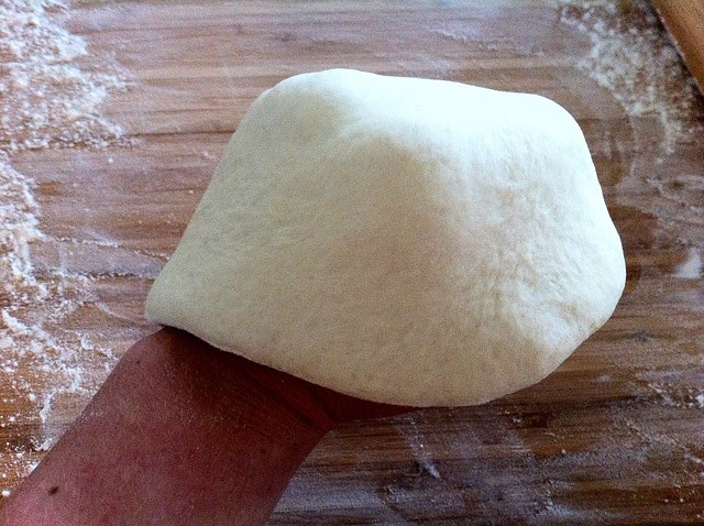 Stretching Pizza Dough Over Knuckles