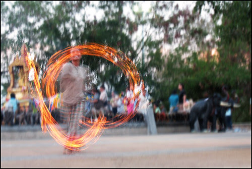 Sunset fire dancer at Cape Phromthep