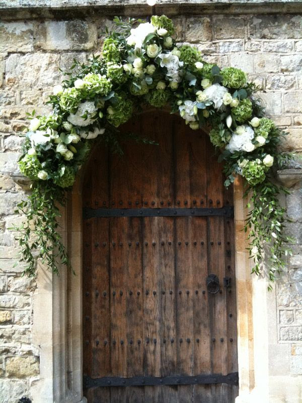 Hydrangeas and rose foliage floral arch