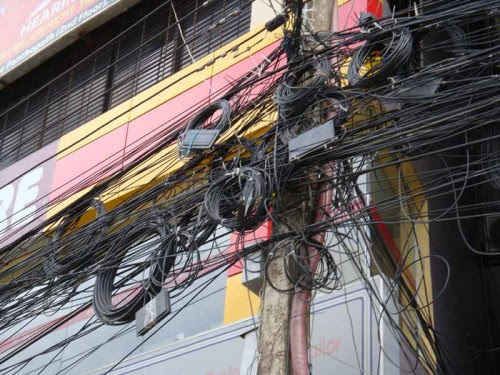 Optical fiber web in a pole in Dhaka. Image Courtesy Wireless Bangladesh