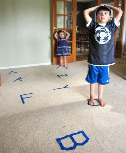 This gross motor activity would be good for learning letters. Have a bunch of letters taped on the floor, play some music and when the music stops, have the child ID the letter they are on