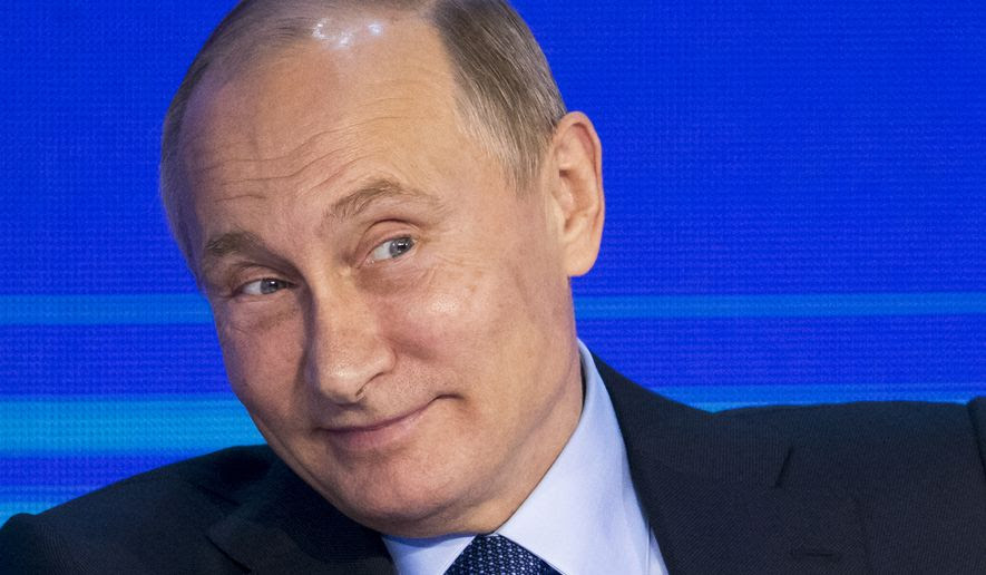 Russian President Vladimir Putin grimaces as he attends the Business Russia Congress in Moscow, Russia, Tuesday, Oct. 18, 2016. Putin said that Russia would offer more freedom to private business to help offset the impact of Western sanctions.(AP Photo/Alexander Zemlianichenko, pool)