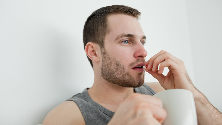 Man_taking_pill