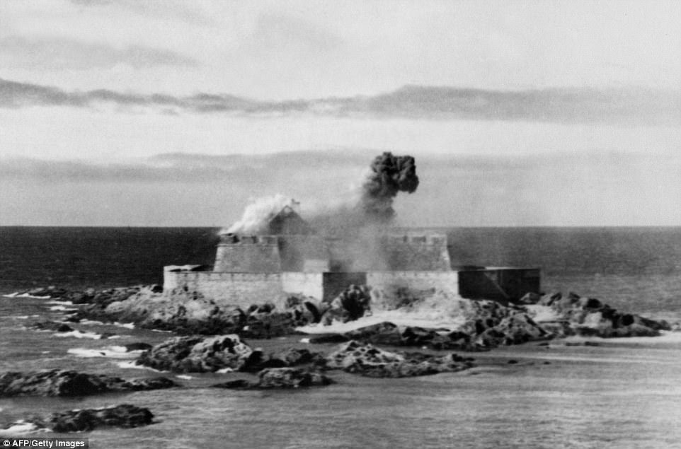 Smoke rises above the German 'festung' - or fortress of St Malo - after it was bombed by US Air Force in August 1944