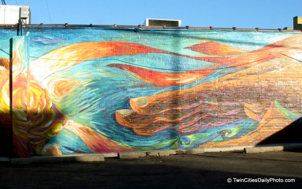 This mural is rather large, it spans from the front of the building all the way to the back. As for the location, I'm on State Street, just before the light at George Street on the West Side neighborhood of St Paul.