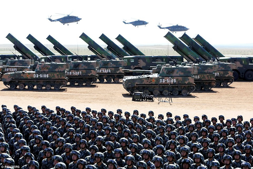 Missile launchers, self-propelled artillery and transport helicopters stand on display behind the formations of troops. Xi said the Chinese military had the capabilities to 'preserve national sovereignty, security and interests'