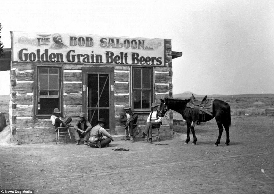 The Bob Saloon in Miles City, Montana, circa 1880. Life was hard on the frontier, so men had little to do after a hard day's work but drink and 'let loose' in their local saloon - even if that just meant having a few beers on the porch, as seen here
