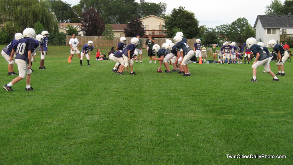 Football season is just starting up. Today's photo is from the Cottage Grove Football Pee Wee division. It is for the boys heading into 5th and 6th grade. This scrimmage between the purple and blue teams was held this week. It's the final scrimmage before the first real game takes place on Saturday morning.