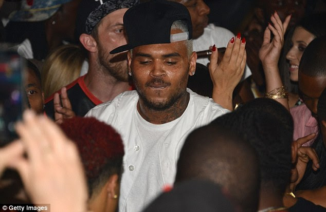 Host: Brown enjoys the party before the alleged shooting took place