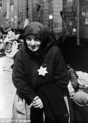 An elderly Jewish woman stands on the loading ramp at Auschwitz Concentration Camp near Oswiecim, Poland, 1943/1944