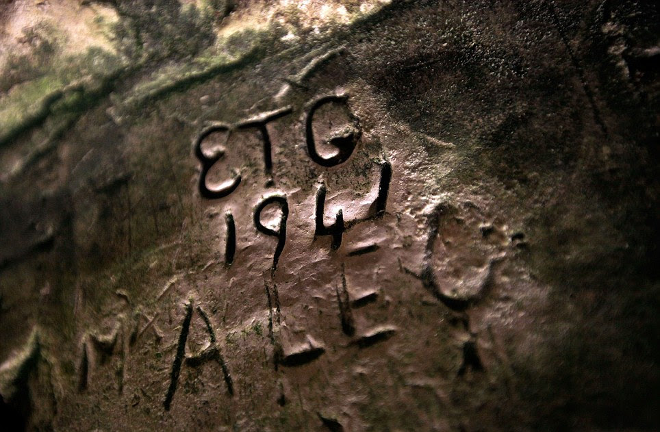 Sign of the times: War-time graffiti carved into one of the subterranean tunnels underneath Dover Castle