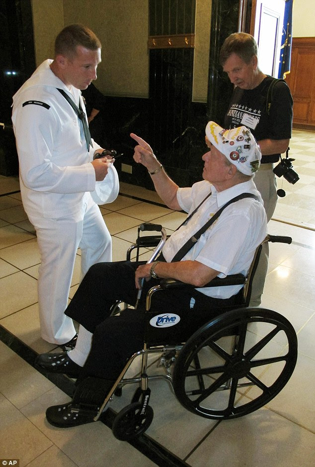 Justin Wray, left, a Navy recruiter in Indianapolis, speaks to USS Indianapolis survivor Clarence Hershberger