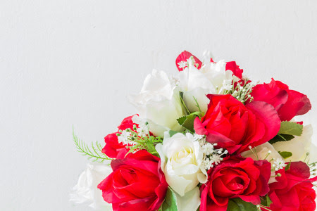 red roses and white roses artificial on a white background with space for text input. Stock Photo - 36805826