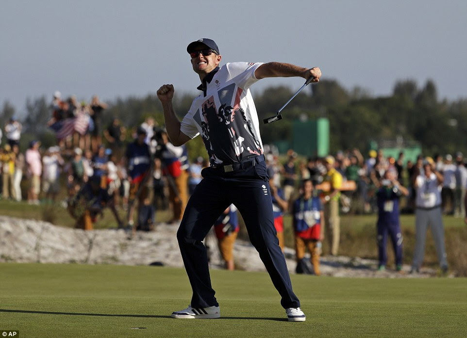 Justin Rose punches the air as he celebrates clinching a gold medal for Great Britain at the Rio Olympics