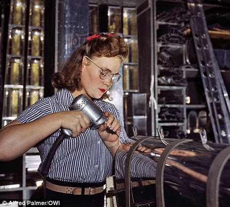North American Aviation drill operator in the control surface department assembling horizontal stabiliser section of an airplane