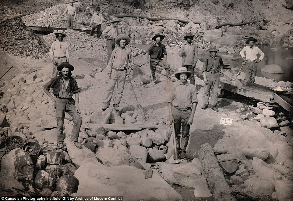 All in a days work: Sterrett & Company Miners surround a stream in October 1852 in a Daguerreotype portrait where a sieve on the right shines brightly with gold nuggets, the fruit of a hard day's labor