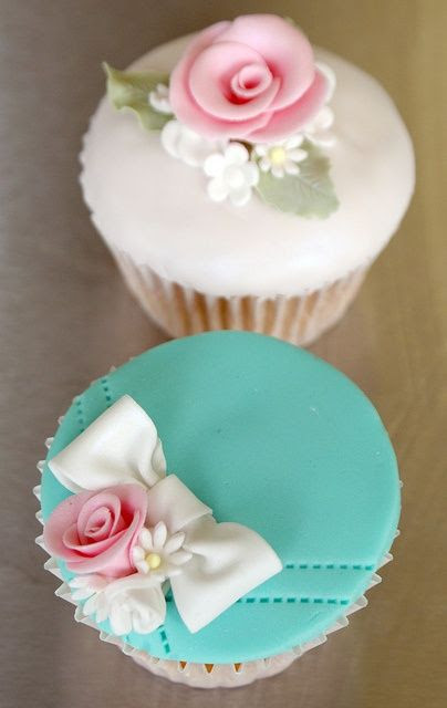beautiful decorated cup cakes with teal blue and pink roses