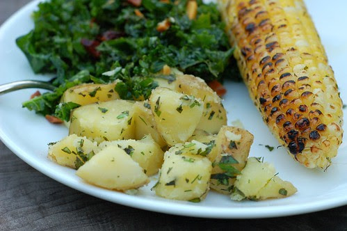 Herby grilled corn with steamed potatoes in herbed butter and massaged kale salad by Eve Fox, the Garden of Eating blog, copyright 2013