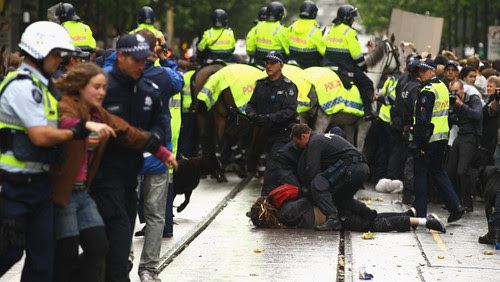 Australian riot police remove protesters occupying areas in Melbourne. The anti-capitalist movement has spread throughout the world. by Pan-African News Wire File Photos