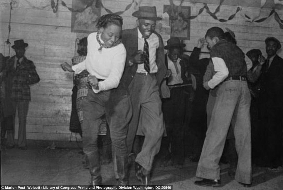 Jitterbuggin': A couple dance enthusiastically in a bar in Clarksdale, Mississippi in 1939, a time of segregation