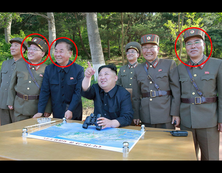 Pointing out food on the menu Kim Jong-un inspects the intermediate-range Pukguksong-2 ballistic missile at a launch test with Kim Jong Sik (2nd L), Ri Pyong Chol (3rd L) and Jang Chang Ha (R)