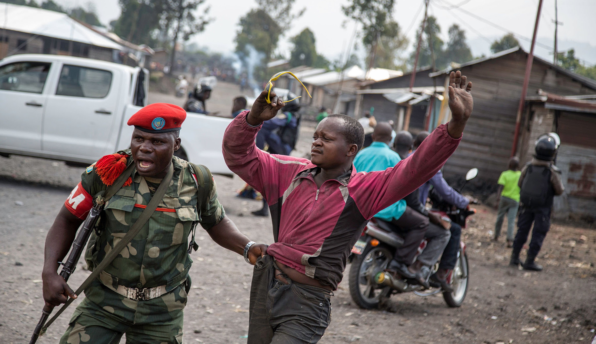 A man is arrested by a member of the military police after people attempted to block the road with rocks,  in the neighbourhood of Majengo in Goma, eastern Democratic Republic of the Congo, on 19 December, 2016, as tensions rose with one day left of Congolese President Joseph Kabila's mandate. Kabila's second term ends on December 20 but he has shown no sign of stepping down and mediation talks have failed, sparking fears of fresh political violence in the mineral-rich but unstable Democratic Republic of Congo. / AFP PHOTO / Griff TapperGRIFF TAPPER/AFP/Getty Images