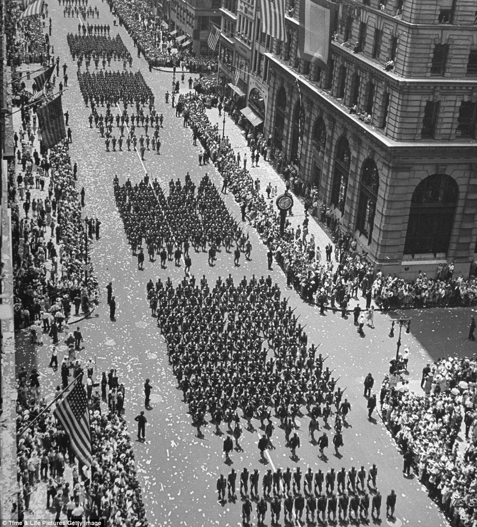 Confetti: Columns of soldiers march in an Independence Day parade up Fifth Avenue in 1942