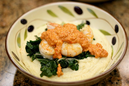 Pan Seared Shrimp with Romesco Sauce over Creamy Grits and Greens