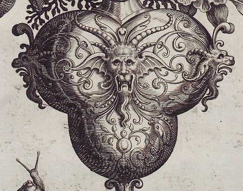 16th c. engraving detail of grotesque faces on vase by Theodore de Bry