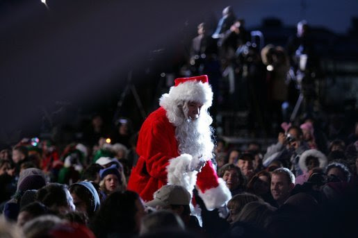 Santa goes into the audience to sing a song , Thursday evening, Dec. 1, 2005, during the Pageant of Peace and the lighting of the National Christmas Tree on the Ellipse in Washington. White House photo by Paul Morse