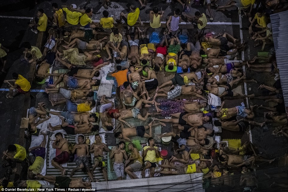 The basketball court at the Quezon City Jail, which has become a sleeping area, in the Philippines 