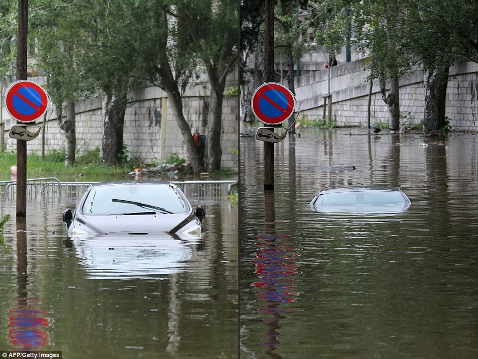 A combination of pictures created shows how a car gradually became submerged by flood water from the river Seine