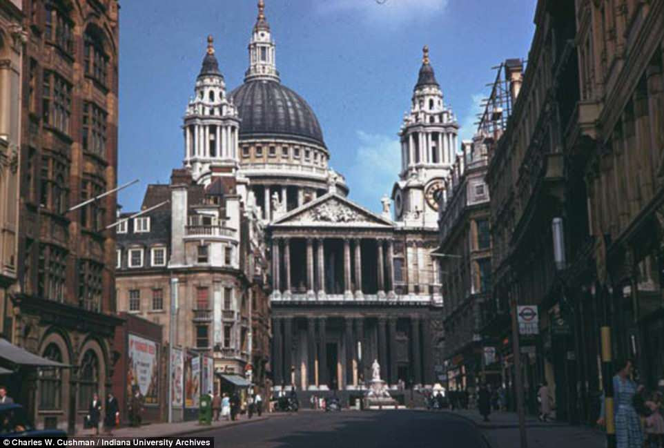 St Paul's Cathedral may look the same as it did in 1961, but the streets below are remarkabley quieter. Not a car is in sight and only a handful of Londoners can be seen strolling along the pavements  