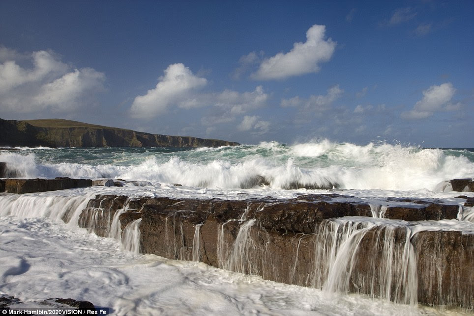 Waves crashing over rocks at the coast the Point of Stoer in the Assynt Mountains