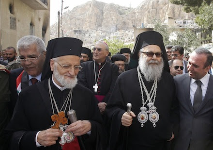 Melkite Catholic Patriarch Gregoire III Laham  and Orthodox Patriarch John X  visit the ancient Christian town of Maaloula, Syria, on Easter Sunday (CNS)