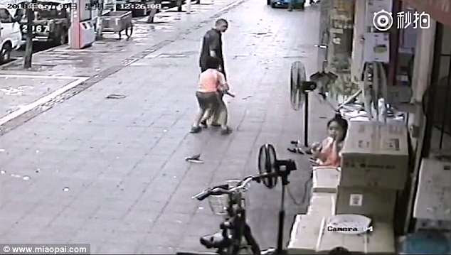 He quickly chases after and grabs his younger brother back before the man walks away