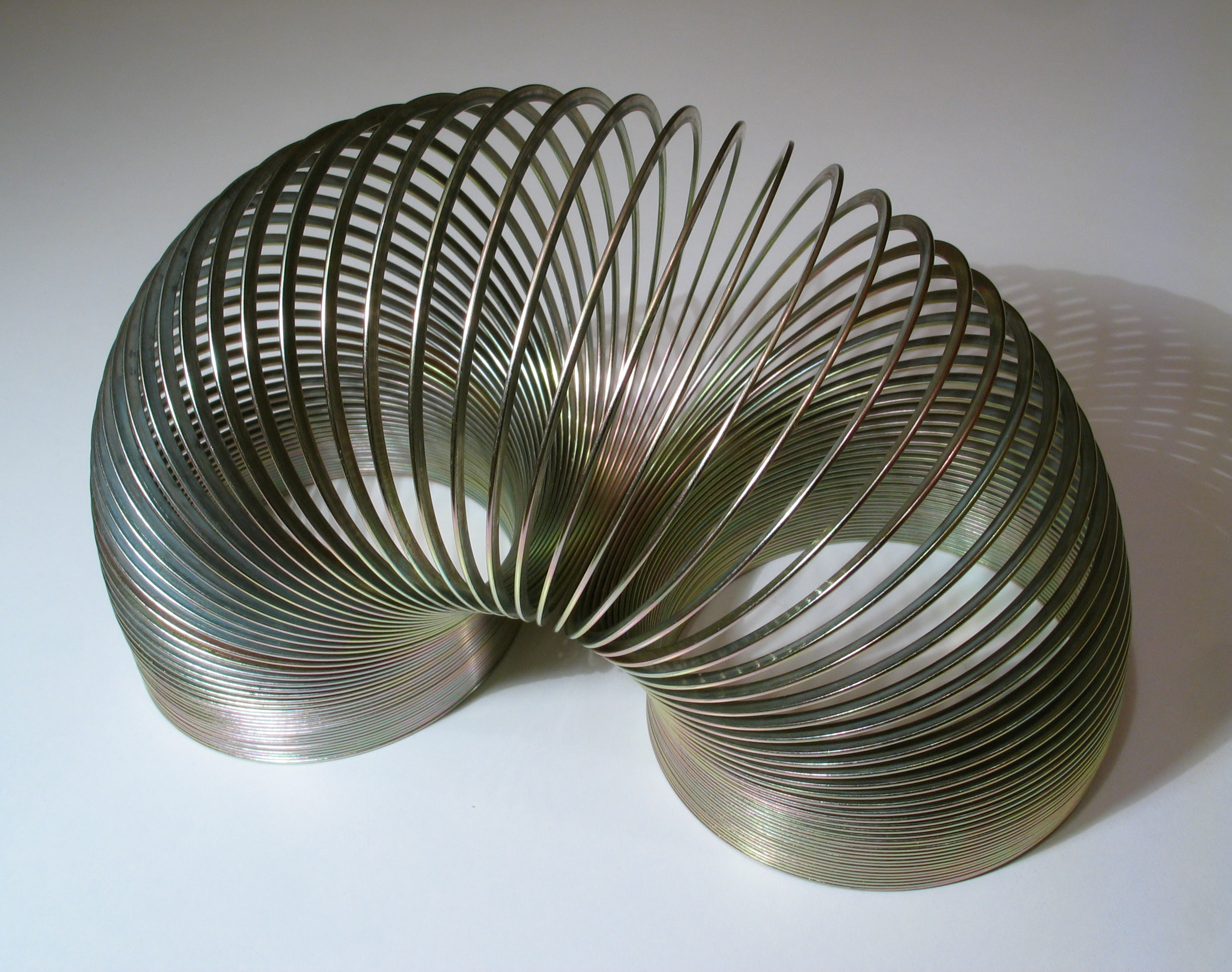 classic silver slinky in arc shape classic silver slinky in arc shape