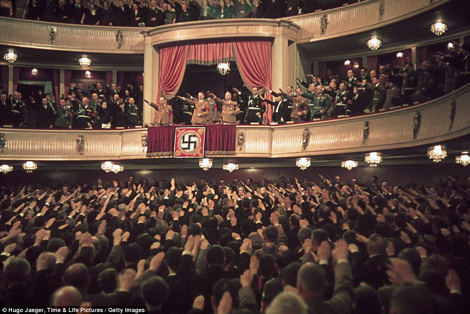 Art of power: Here, Hitler and Goebbels are seen in the Charlottenburg Theater's honor box as everyone salutes. A failed playwright himself Goebbels saw to it that no Jewish writers practiced their craft under Hitler's reign