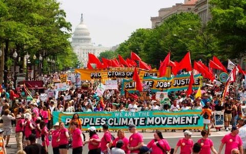 Demonstrators march on Pennsylvania Avenue during the People's Climate March in Washington DC