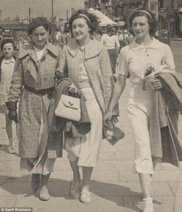 Outing: Three ladies take to the streets of Littlehampton on the Sussex coast wearing sandals, long skirts and thick collared coats in 1936