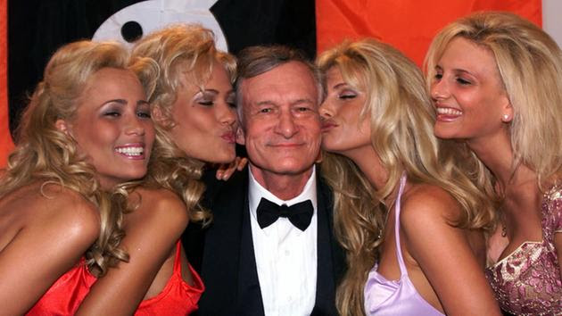 <div class='meta'><div class='origin-logo' data-origin='none'></div><span class='caption-text' data-credit='AP'>Playboy founder and editor in chief Hugh Hefner receives kisses from Playboy playmates in Cannes, France, Friday, May 14, 1999 during the 52nd Cannes Film Festival.</span></div>