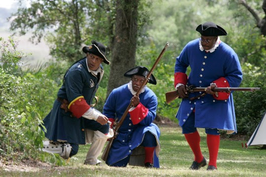 Living historians reenact the Battle of Bloody Mose.