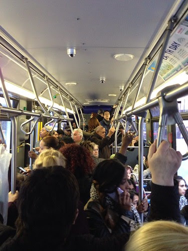 On a crowded crosstown bus