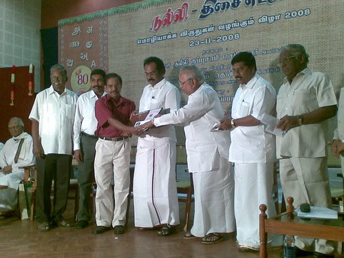 Dr. Raghuram receiving award for best translation (from Malayalam to Tamil)