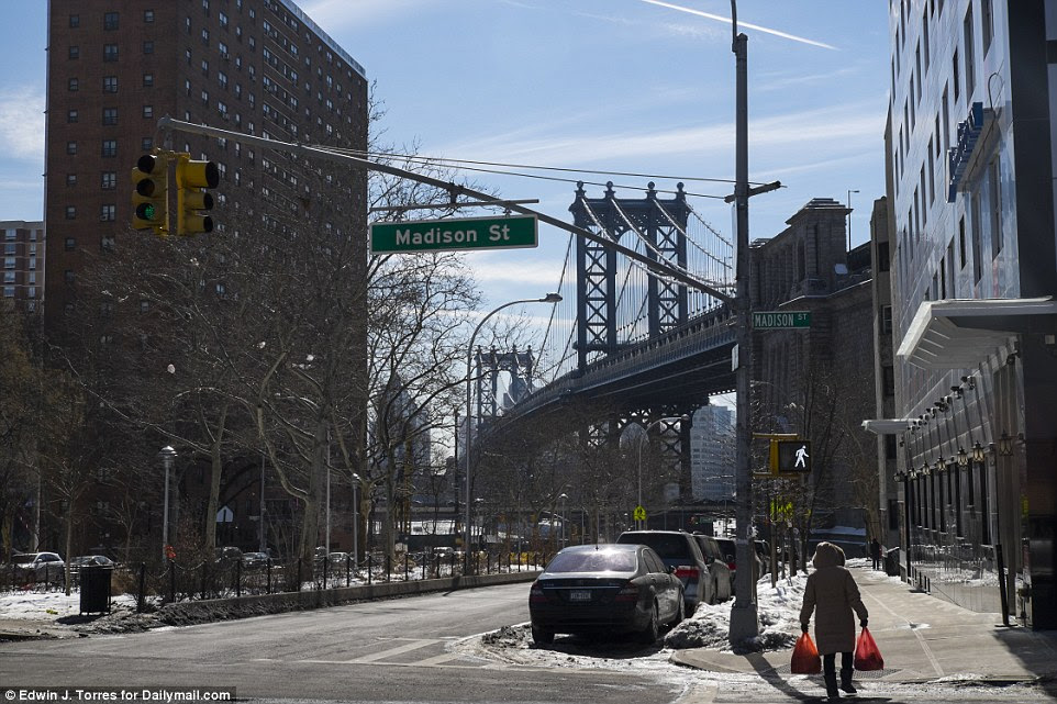 The intersection at Pike Street and Madison Street, looking south towards the Manhattan Bridge. Tenement housing from the 1940s has now been replaced with a large public housing complex