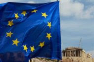 A European Union flag is seen in front of the Parthenon temple in Athens February 21, 2012.   REUTERS/John Kolesidis