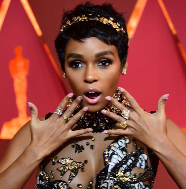 Janelle Monae narrowly avoids nip slip in her embroidery extravagant gown.