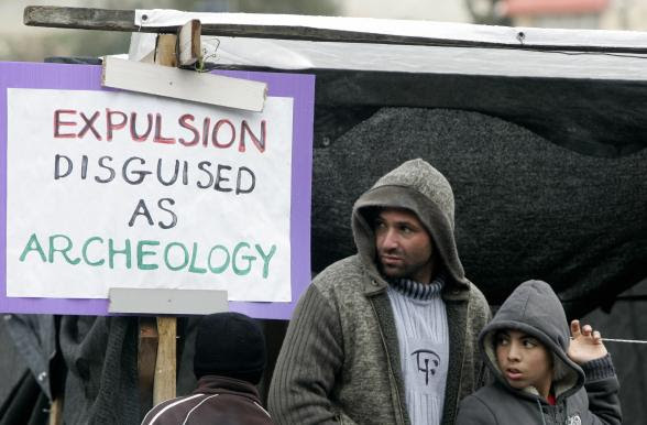 Palestinian Muslims stand in front of a